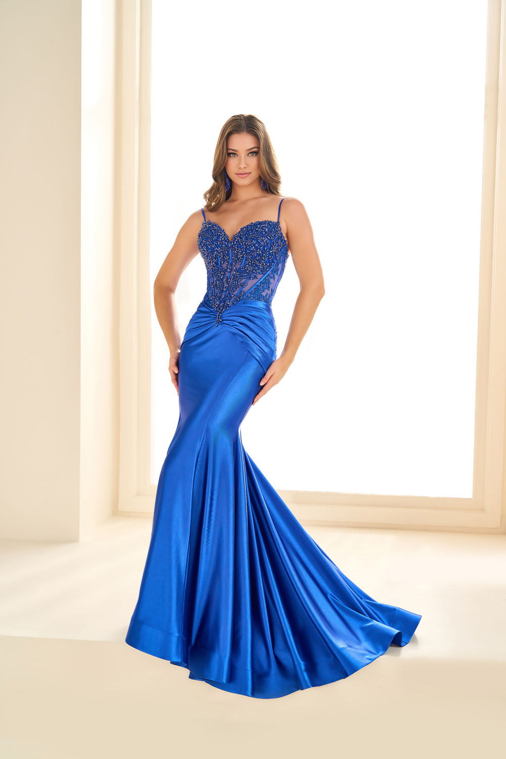 Ellie Wilde EW36004 mermaid prom dress images.  Ellie Wilde EW36004 is available in these colors: Rose Gold, Royal Blue, Misty Blue Silver, Sea Glass Silver, Black, Gold, Red.