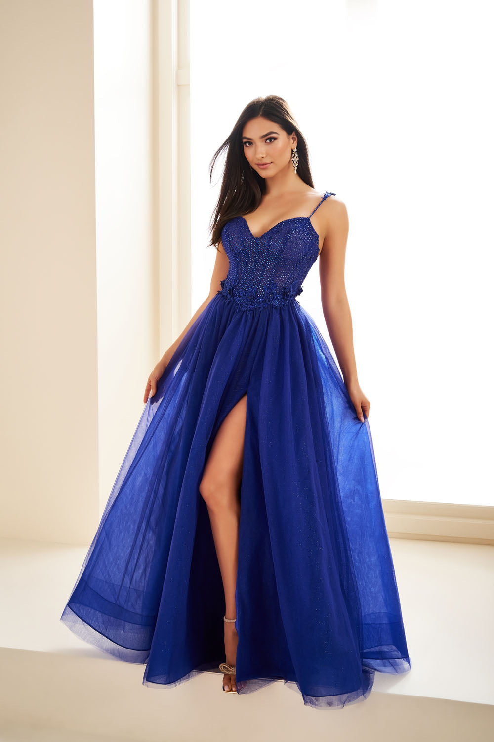 Ellie Wilde EW36058 a-line prom dress images.  Ellie Wilde EW36058 is available in these colors: Gold, Black, Royal Blue.