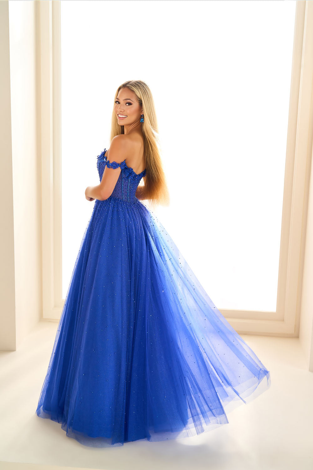 Ellie Wilde EW36071 ball gown prom dress images.  Ellie Wilde EW36071 is available in these colors: Royal Blue, Emerald, Dusty Rose Gold.