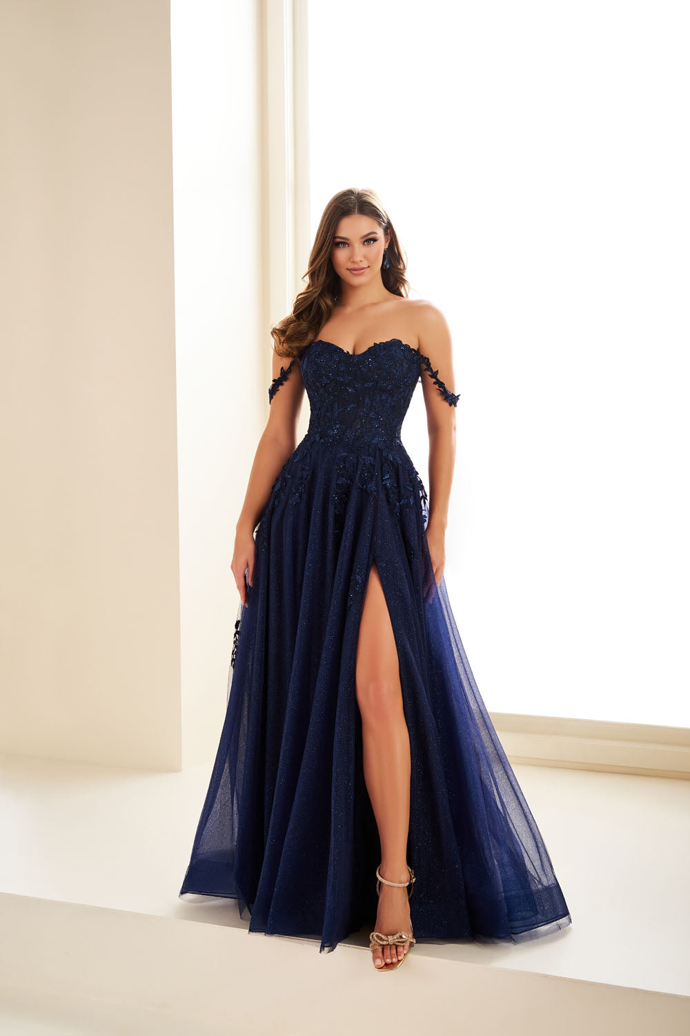 Ellie Wilde EW36083 a-line prom dress images.  Ellie Wilde EW36083 is available in these colors: Dark Purple, Dusty Rose Gold, Navy Blue, Emerald.