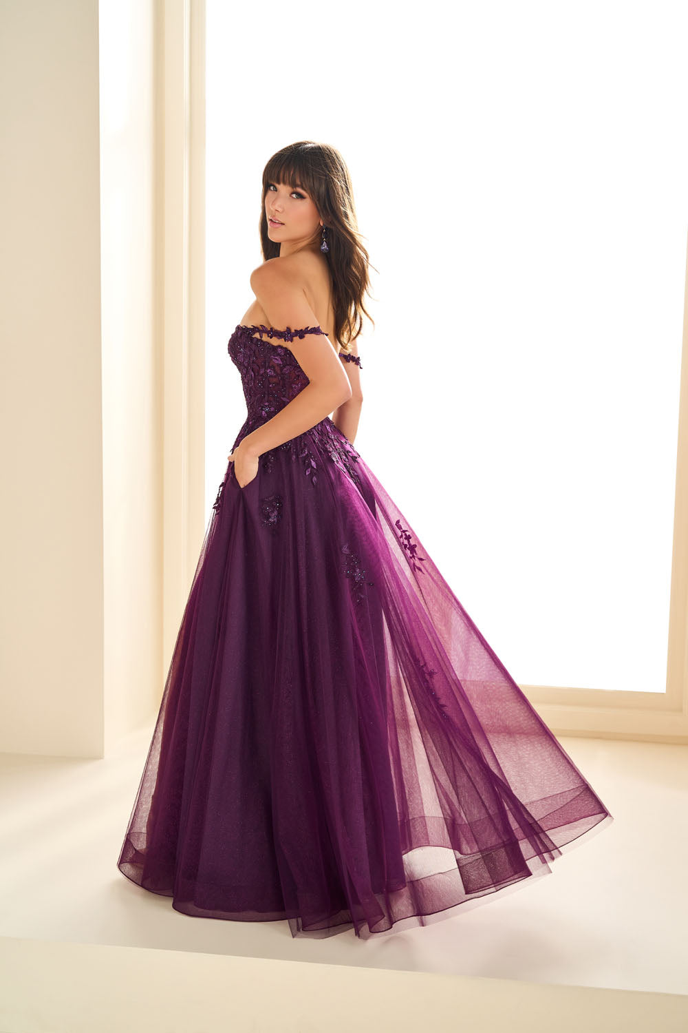 Ellie Wilde EW36083 a-line prom dress images.  Ellie Wilde EW36083 is available in these colors: Dark Purple, Dusty Rose Gold, Navy Blue, Emerald.