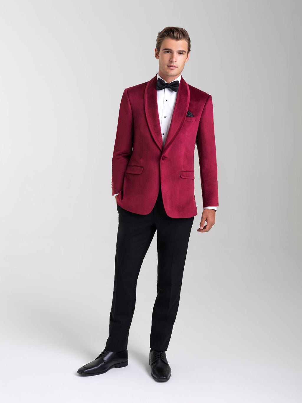 Ruby Red Venice Velvet Tuxedo is a single button shawl lapel jacket with double vents and a Ultra Slim tailored fit